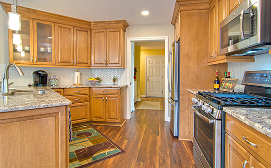 beautiful remodeled contemporary kitchen with stainless appliances.