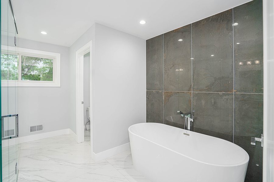 Newly renovated bathroom with bath tub and lots of natural light.